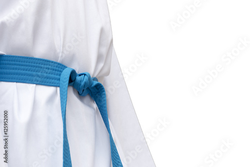Closed up blue belt in white taekwondo dress