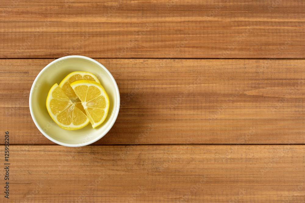 Fresh lemon on wood background. Top view. Fresh lemon on wood background. Top view.