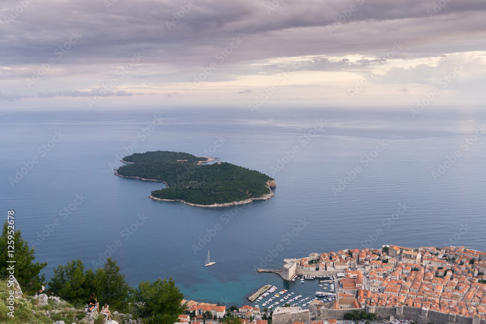 The view of the old town of Dubrovnik, and the Island of Lokrum from the Mt Srd cable car on a cloudy day.