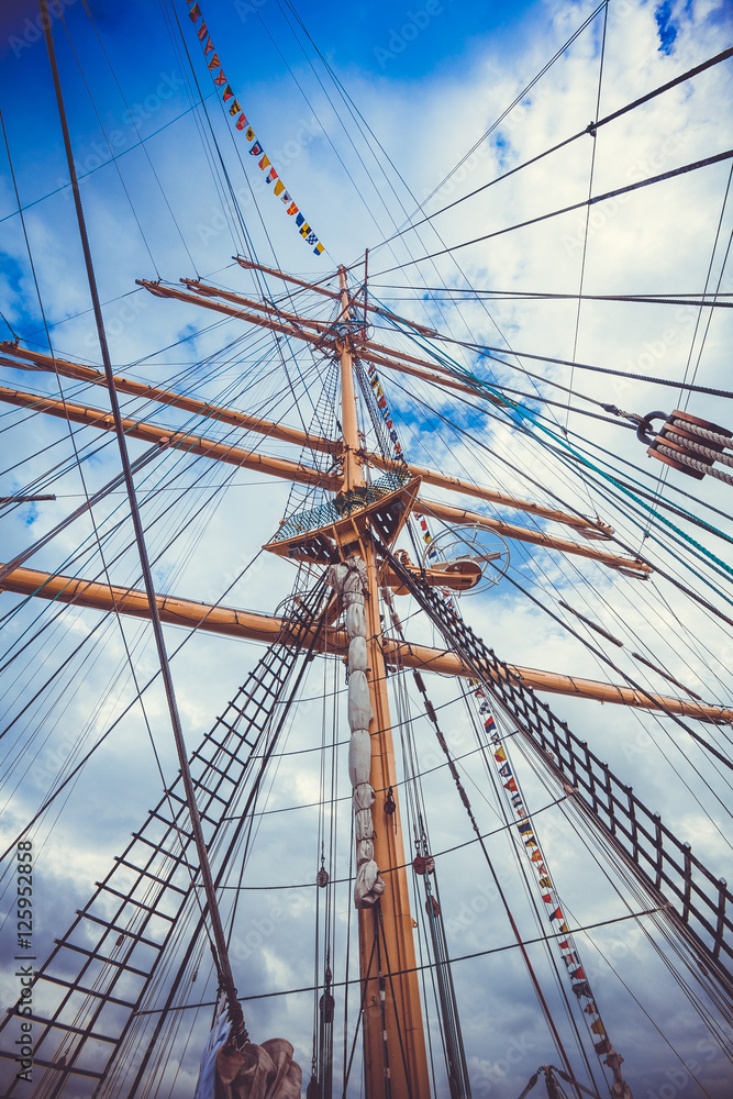 Detail of a sailboat rigging. Mast on traditional sailboats. Ma Detail of a sailboat rigging. Mast on traditional sailboats. Ma