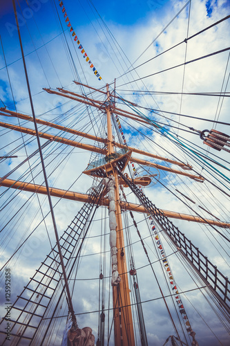 Detail of a sailboat rigging. Mast on traditional sailboats. Ma