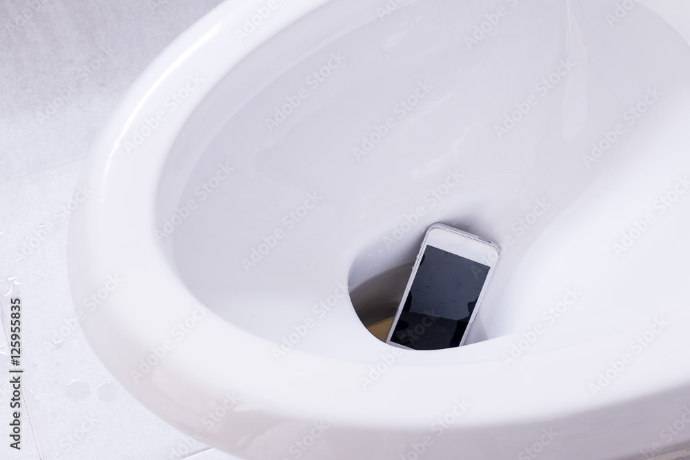 phone fell.smart phone wet fell in the toilet bowl. Stock Photo | Adobe  Stock