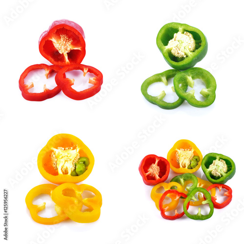 Sliced red yellow green pepper isolated on white