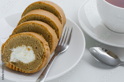 Coffee Cake Roll with A Cup of Tea On Tea Breaking Time.