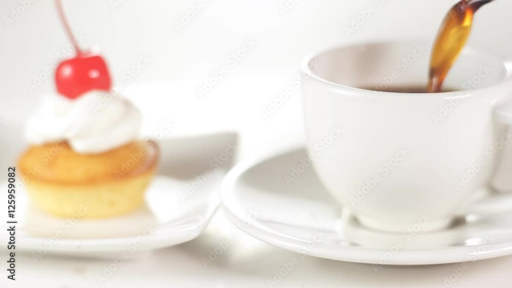 Poring a coffee into the white cup Poring a coffee into the white cup