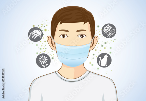 Boy wearing breath mask for protect something that cause allergic reactions include pollen, dust particles and animal, bacteria. photo