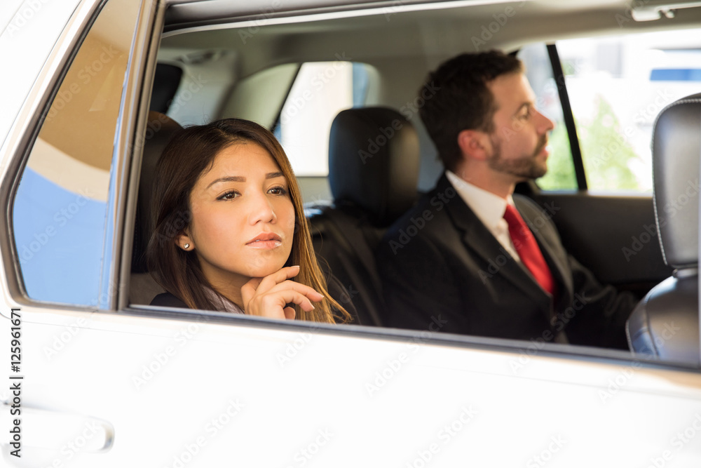 Businesswoman traveling by car