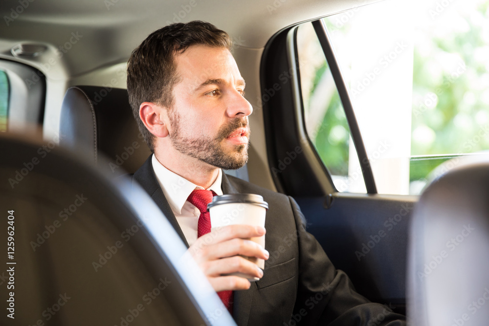Drinking some coffee while riding a car Drinking some coffee while riding a car