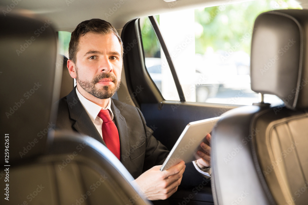 Latin businessman in a car ride