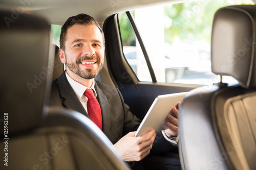 Businessman using tablet in a car © AntonioDiaz