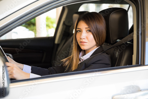 Pretty young woman driving a car