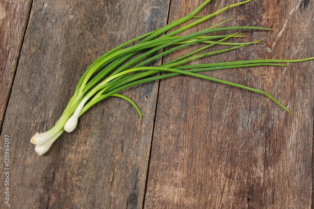 Green onion. health food on a wooden table. Green onion. health food on a wooden table.