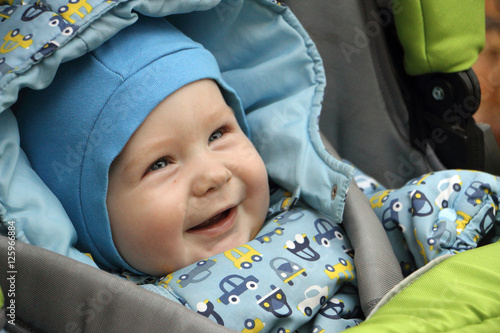portrait of baby on a walk in the stroller