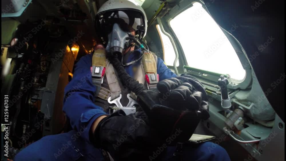 The pilot checks the control knob The pilot checks the control knob