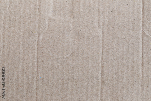 Texture of the brown paper box or cardboard.