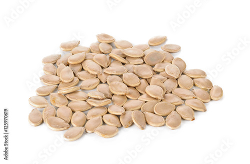 Pumpkin seeds on the white background