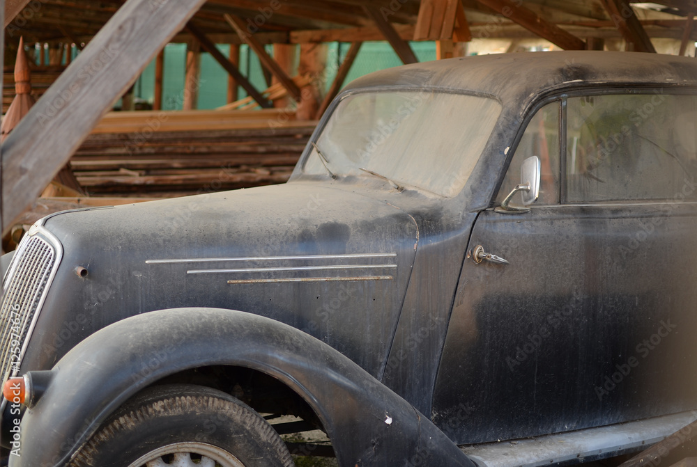 Old veteran car parked in the barn