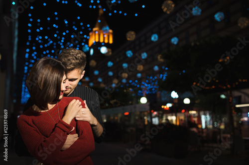 Love couple in the night city. Feelings. Love photo