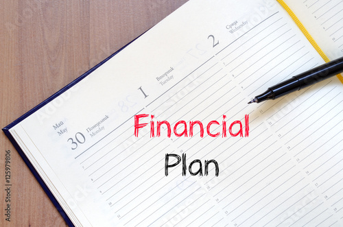 Financial plan text concept on notebook