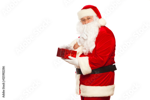 Santa Claus: Cheerful With Small Stack Of Gifts big bag, isolated on white background Christmas.