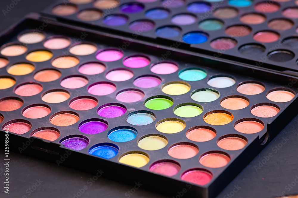 Make-up colorful eyeshadow palettes isolated on black background Make-up colorful eyeshadow palettes isolated on black background