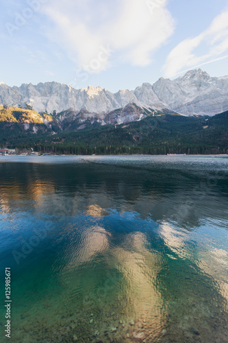 Beautiful vibrant landscape with sundown on mountain lake Eibsee, Bayern, Bavaria, Germany