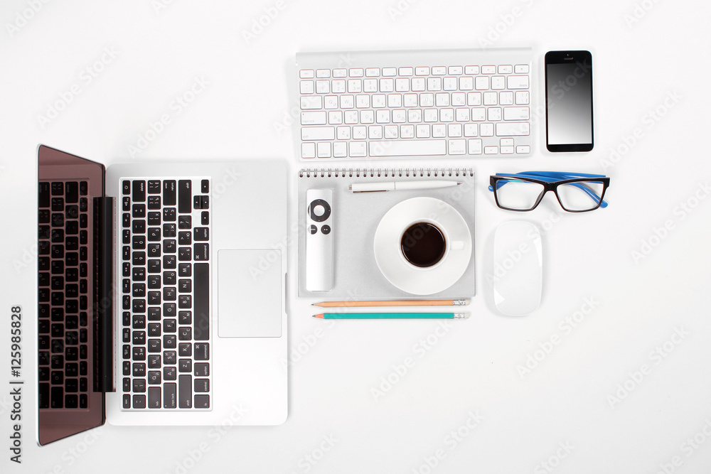 Business desk with a keyboard, mouse and pen on white table Business desk with a keyboard, mouse and pen on white table