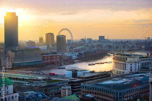  London at sunset, view at the Westminster side of the city, River Thames and London bridge sun reflection 