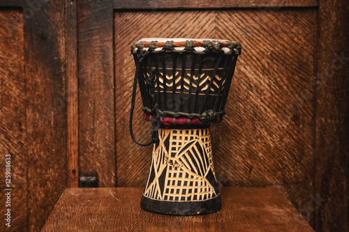 hand drum Indian on vintage wooden background photo