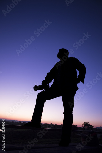 silhouette photo of photographer