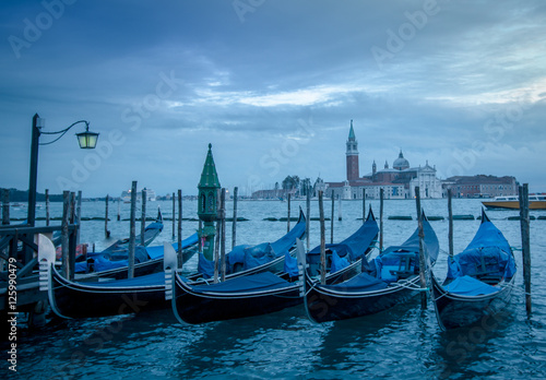 Gondolad in Venice with the church San Giorgo Maggiore in the ba © Amineah