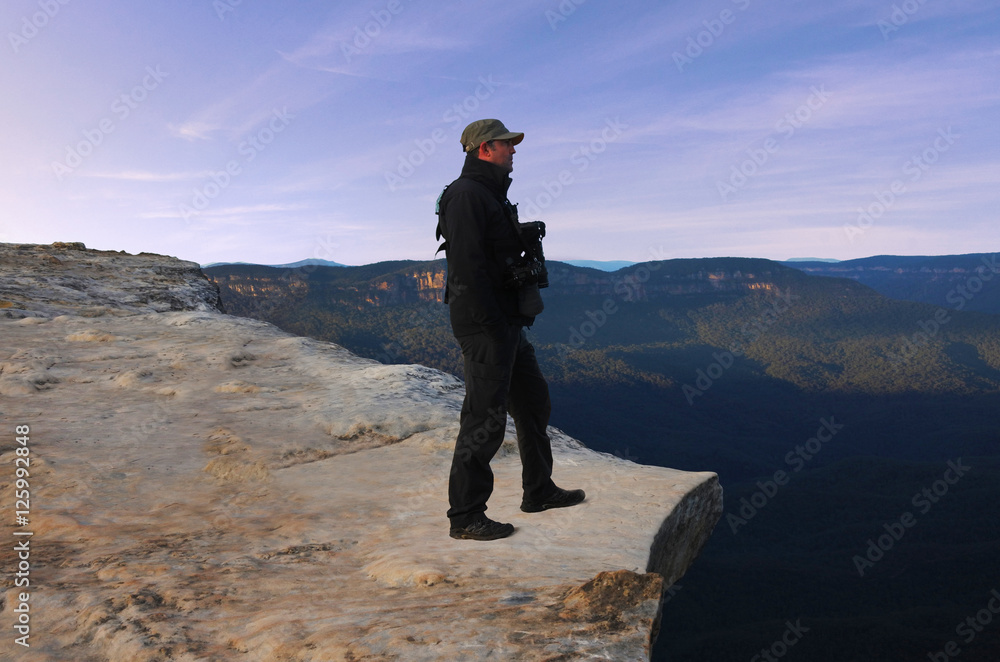 Man looks at the landscape from Lincoln Rock Lookout at sunrise Man looks at the landscape from Lincoln Rock Lookout at sunrise