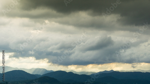 The raining clouds over the layers of the mountain.