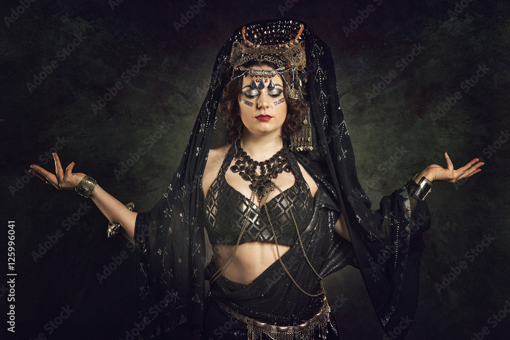 Young woman with long dark hair in east costume Young woman with long dark hair in east costume