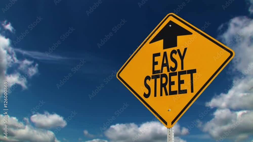 A road sign pointing to the direction of Easy Street. A road sign pointing to the direction of Easy Street.