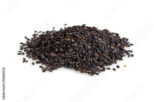 Pile of black sesame seeds isolated on white background