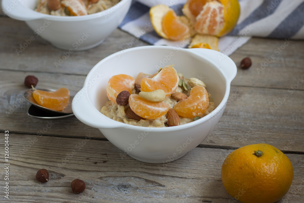 Oatmeal with tangerine and walnuts. Oatmeal with tangerine and walnuts.