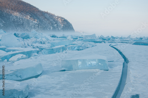 Fog rocks and field of ice siberian Baikal Lake in winter