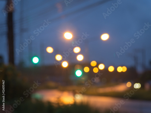 Lights blurred bokeh background from road side at night time.