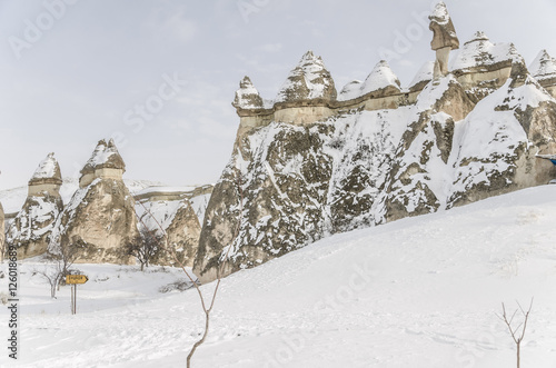 Unique geological rock formations under snow in Cappadocia  Turk