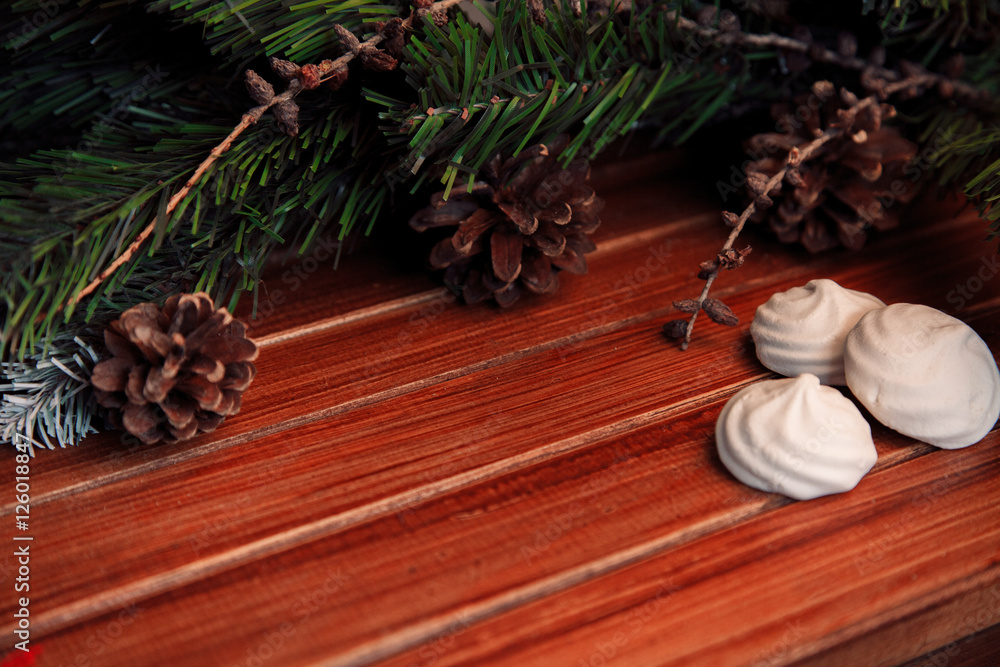 Christmas background on wood. gift and marshmallows Christmas background on wood. gift and marshmallows