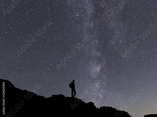 beauty Milky way landscape on square format with man silhouette