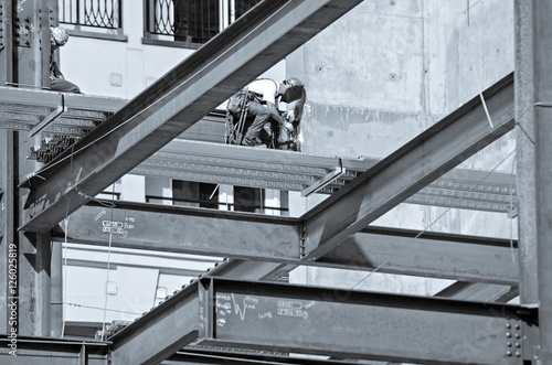 construction worker working on highrise building photo