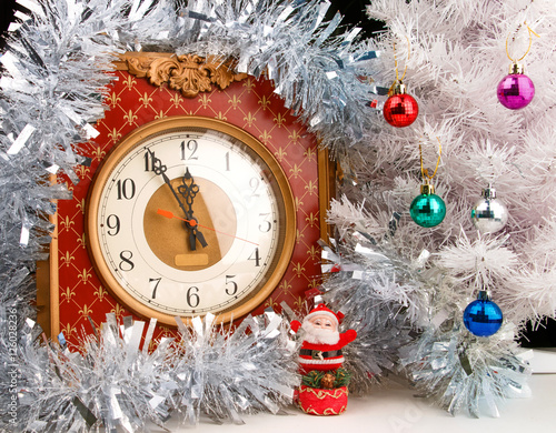 Vintage watch with small Santa and decorated white christmas tree