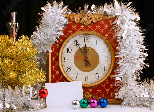 Vintage analog watch with yellow christmas tree on dark background