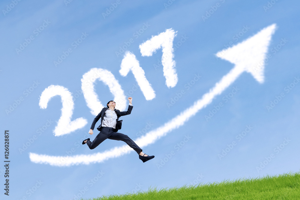 Entrepreneur leaping with number 2017 and arrow Entrepreneur leaping with number 2017 and arrow