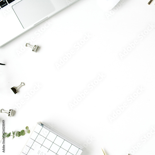 Flat lay, top view office table desk. feminine desk workspace with laptop, diary on white background.