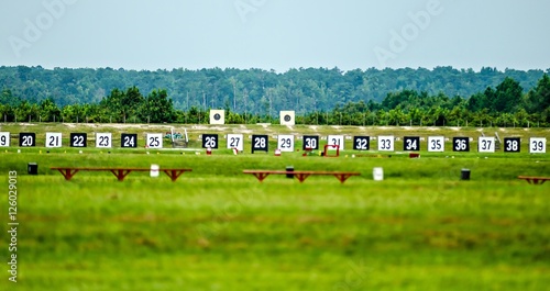 Targets for a shooting range with bulls-eye's are lined up in a