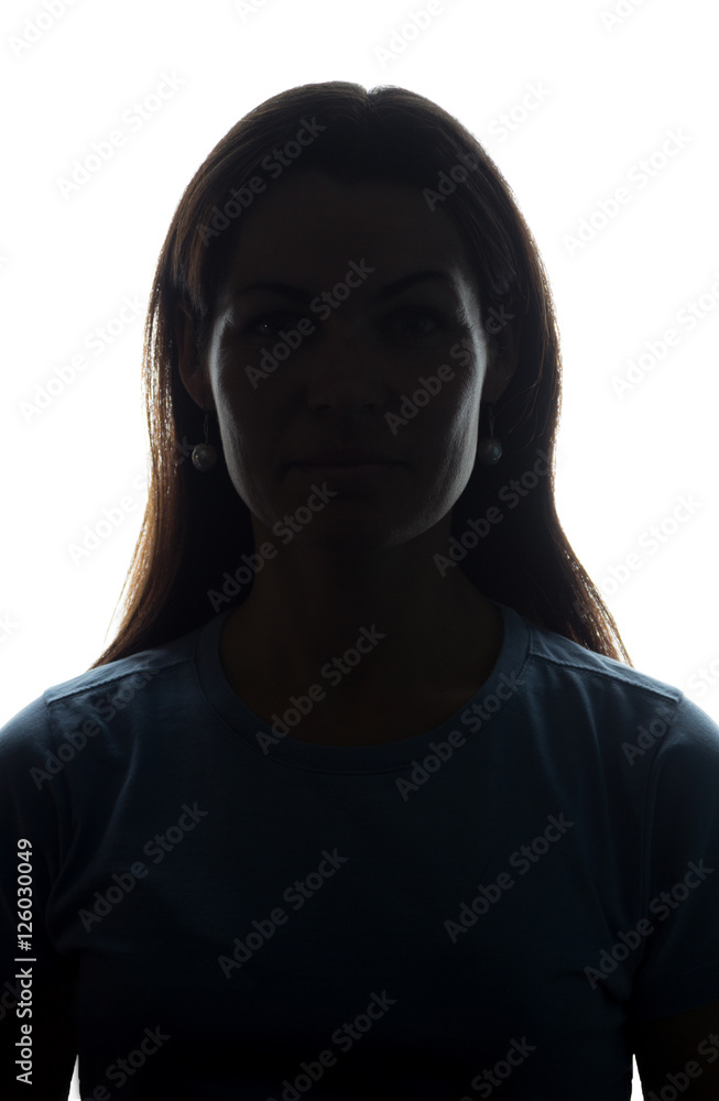 Young woman look ahead with flowing hair - vertical silhouette