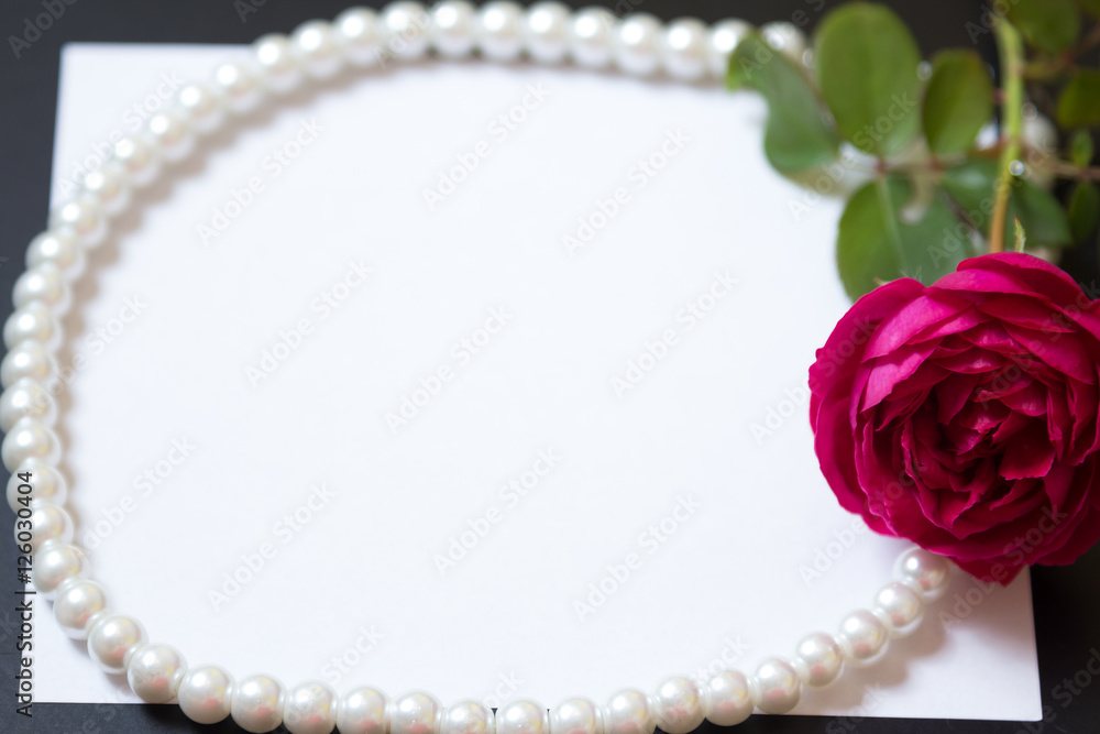 Beautiful red rose with pearls on blank white sheet paper Beautiful red rose with pearls on blank white sheet paper